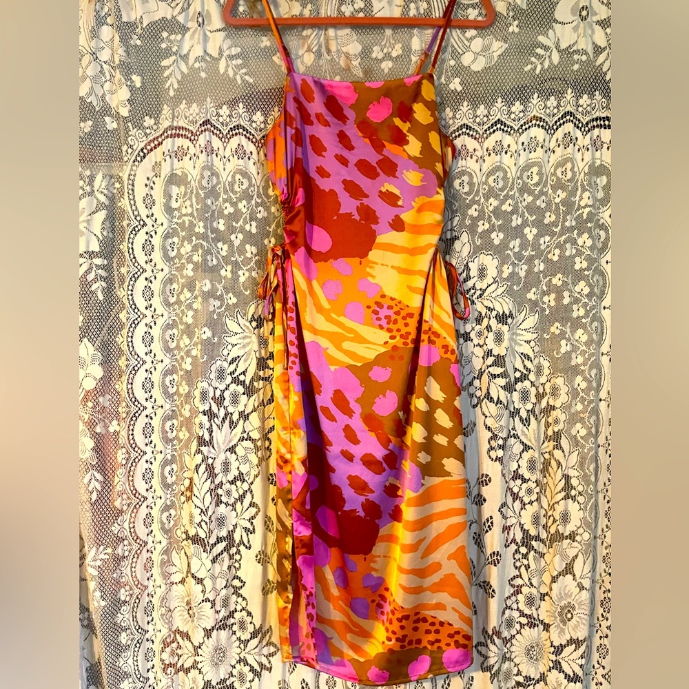 Christian lacroix multicolored midi dress with side cut outs.